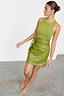 Thumbnail for Olive green vegan leather Mini Jaspre wrap skirt styled with a matching ribbed top and heels.