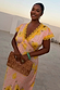Pink Fawn Poppy Olivia Midaxi Dress with yellow lace trim and floral print, highlighting inclusive sizing on a model.