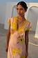 Pink Fawn Poppy Olivia Dress featuring yellow lace trim and a yellow floral print on a pink base.