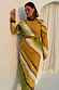 Green Ombre Alba Dress with long sleeves, waist cut-outs and stone beads, styled in earthy tones for inclusive sizing.