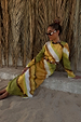 Green Ombre Alba Dress with a cut-out waist and stone beading in an earthy cotton-linen blend, styled for vacation.