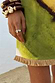 Thumbnail for Green Ombre Deia Dress hem detail with a textured raffia trim and earthy green and yellow tones.