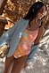 Orange Dreamer Scoop Swimsuit featuring sun and palm prints and buckle waist detail, styled with a light blue shirt.
