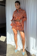 Orange leopard Elissa shorts and matching Geanie shirt set with white paisley palm prints.