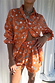 Model wearing the Orange Leopard Elissa Short and matching shirt in a bold paisley and palm print.
