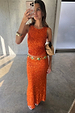 Orange Sequin Dorris Skirt in a shimmering finish, styled with a matching top and gold statement belt.
