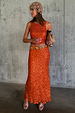 Orange Sequin Dorris Skirt in burnt orange, styled as a co-ord set with a matching sleeveless top and gem belt.