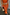 Thumbnail for Orange Sequin Dorris Skirt in burnt orange, styled with a matching top and a green stone belt.