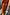 Thumbnail for Orange Sequin Dorris Skirt in burnt orange sequins, styled with a gold-toned belt and a beaded clutch.
