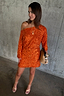 Thumbnail for Burnt orange sequin Tilly mini dress with a shimmering asymmetric off-the-shoulder neckline, styled with a woven clutch.