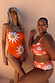 Orange Sun Bandeau Swimsuit with oversized sun motifs and gold embroidery, shown on models for inclusive sizing.