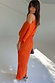 Orange Tilly Dress featuring a metallic gold fleck print, draped asymmetrical shoulder and fitted midaxi skirt.