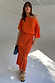 Thumbnail for Orange Tilly Dress with a gold fleck print, featuring an asymmetric off-the-shoulder neckline and midaxi length.