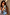 Thumbnail for Orange Acetate Visor Sunglasses with 70s-inspired tinted lenses worn by a model in a wave print dress.