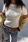 Thumbnail for White Oyster Baby T Shirt featuring a fine line oyster and lemon print, styled with blue jeans and a yellow cardigan.
