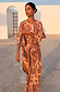 Model wearing Peach Paisley Balloon Trousers and matching shirt as a co-ord set outdoors.