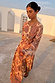 Peach Paisley Anna Top with a tie waist and long sleeves, styled with matching balloon trousers in an outdoor setting.
