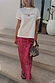 Pink Paisley Dorris Skirt in a relaxed silhouette with a paisley print, styled with a white graphic tee.