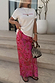 Pink Paisley Dorris Skirt with a bold print and relaxed midi fit, styled with a white tee and beaded bag.
