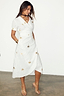 Thumbnail for White Cotton Linen Brooklyn Dress featuring gold metallic palm flecks and an adjustable wrap waist on a model.
