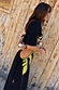 Thumbnail for Black Palm Riviera Dress featuring a lime green palm motif and side cut-out detailing.