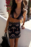 Thumbnail for Black Palm Sarong with palm tree motifs and a border print, styled as a wrap skirt for a multi-wear vacation look.