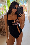 Black Palm Embroidered Bandeau Swimsuit featuring a pink palm motif and whipstitch trim, styled for a vacation.