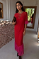 Red sheer mesh Katie Dress featuring pink tiered frills on the sleeves and hem, styled with a leopard clutch.