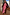 Thumbnail for Pink Bandana Dorris Skirt featuring an iconic paisley print in a relaxed midi silhouette, styled on a model.
