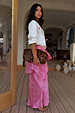 Pink Bandana Dorris Skirt in an iconic paisley print and relaxed silhouette, styled with a leopard clutch.