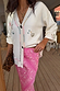 Pink Bandana Dorris Skirt with a white paisley print, styled with a white embroidered cardigan and leopard print clutch.