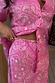 Pink Bandana Dorris Skirt featuring a white paisley print on a bold pink base, styled as a vibrant co-ord set.