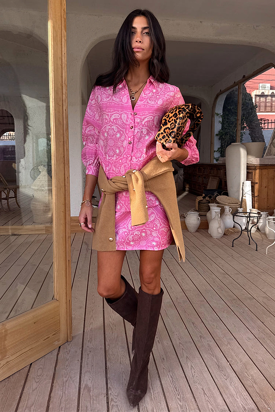 Pink Bandana Miley Shirt with blouson sleeves and tortoise buttons, paired with a matching skirt and brown boots.