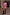 Thumbnail for Pink Bandana Mini Dorris Skirt and matching shirt with a tan jumper tied at the waist and brown boots.