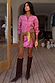 Pink Bandana Mini Dorris Skirt and matching shirt with a tan jumper tied at the waist and brown boots.