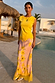 Pink Fawn Poppy Midi Maeva Skirt with a yellow lace border and deer motifs, paired with a yellow top.