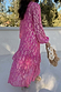 Thumbnail for Pink Jacquard Harmony Dress with gold animal print, tiered skirt and long sleeves, styled with a fringed bag.