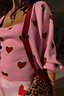 Pink Hearts Cardigan in a soft knit with red heart motifs, contrast red ribbed trims and button fastenings.