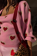 Pink Hearts Cardigan in a soft knit with red heart motifs, contrast red ribbed trims and button fastenings.