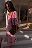 Pink Hearts Cardigan featuring red heart motifs and contrast trims, paired with a matching heart print skirt.