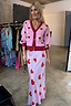 Knitted Pink Hearts Cardigan with red heart motifs and contrast trims, paired with a matching heart print slip skirt.