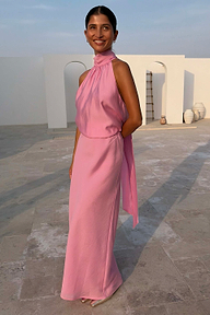 Pink Billie Top with a high halterneck and multi-wear ties, styled as a co-ord with a matching pink maxi skirt.