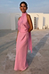 Pink Billie Top with a high halterneck and multi-wear ties, styled as a co-ord with a matching pink maxi skirt.
