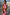 Thumbnail for Pink Billie Top featuring a high gathered halterneck and draped fit, styled in an outdoor architectural setting.