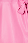 Detail of the pink vegan leather fabric and wrap tie fastening on the iconic Mini Jaspre Skirt.