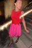 Thumbnail for Red and Pink Mini Monika Dress featuring a panelled corset-style top and pleated skirt, styled for a London night out.