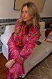 Pink Paisley Oslo Cardigan in a soft knit with red ribbed trims, styled with a matching skirt for a bold London look.
