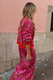 Pink Paisley Oslo Cardigan with an intricate red print and ribbed cuffs, worn as a dopamine dressing co-ord.