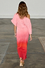 Pink and red ombre Tilly Dress in gold shimmer plisse with a draped asymmetric neckline, shown from the back.