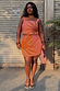 Pink Sol Beaded Wrap Skirt with a hand-embroidered sun motif and gold sequins on a size L model.